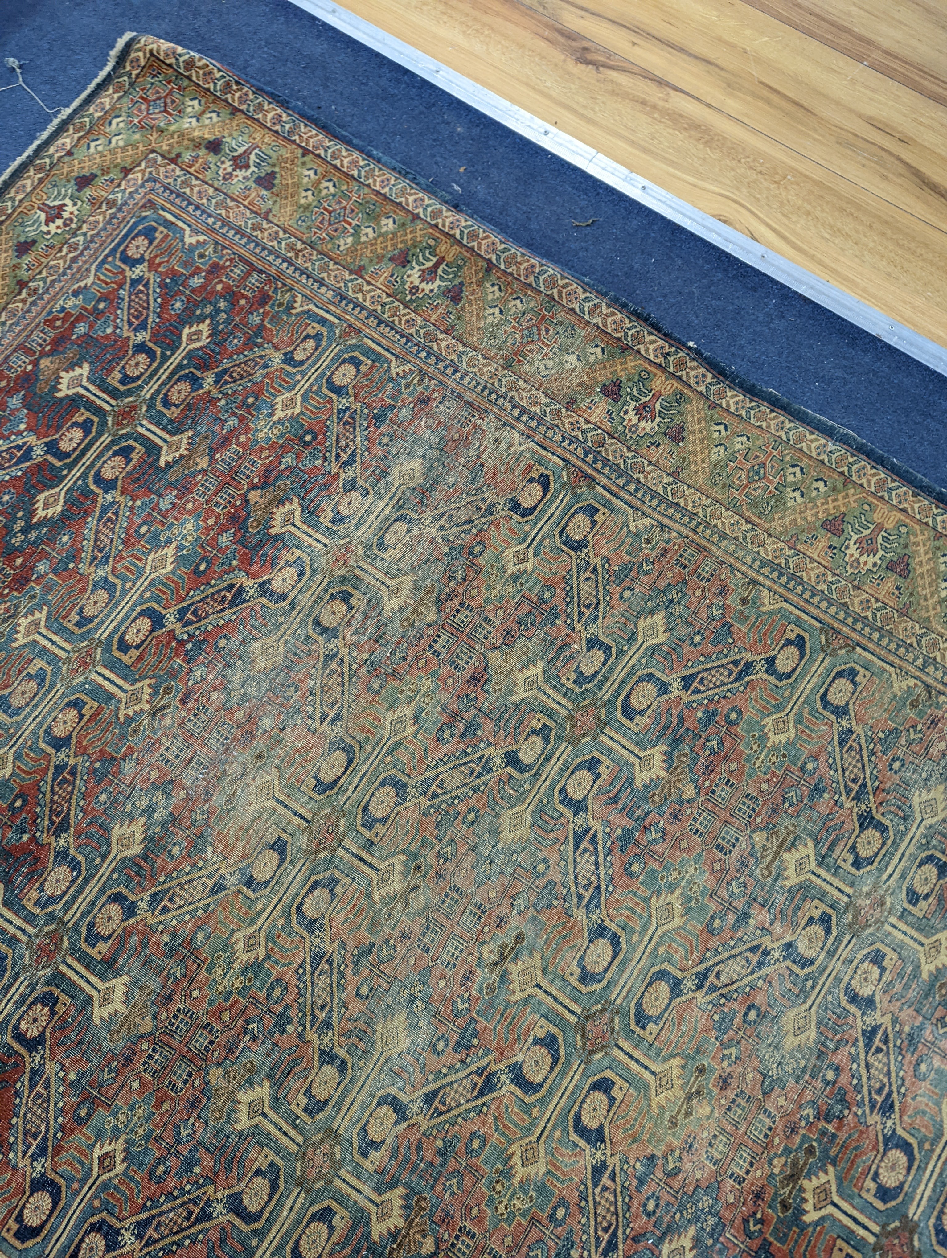 Three antique rugs, Caucasian and North West Persian, largest 230 x 154cm